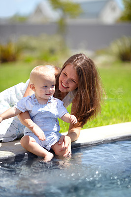 Buy stock photo Pool, water and mom with baby in garden or child splash with legs for fun, game or experience. Happy kid, swimming and mother outdoor with son dipping toes in pond, liquid or playing in backyard