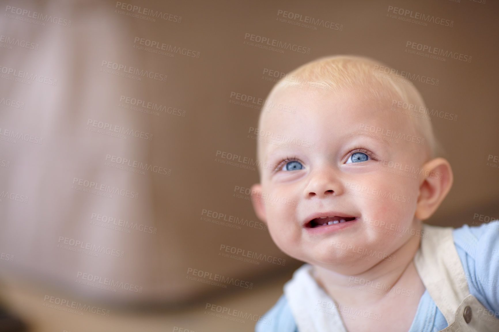 Buy stock photo Baby, face and look up curious thinking for explore home, safety or parent. Boy, son and comfort relax for healthy  childhood development or love living room or playful, growth support or calm care