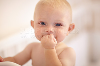 Buy stock photo Happy, face and toddler standing in crib, bedroom or excited baby boy with hands on teething mouth in morning, nap or afternoon. Kid sitting in cot, awake and healthy bed routine for young child