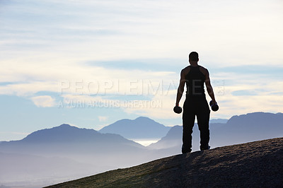 Buy stock photo Fitness, weightlifting and back of man with dumbbells on mountain top for morning cardio on sky background. Weights, freedom and rear view of male bodybuilder in nature for training, power or workout