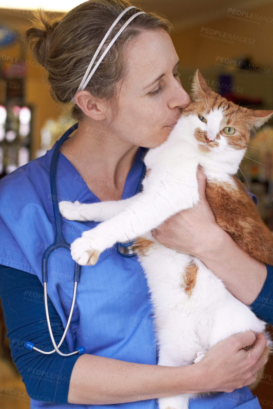 Buy stock photo Veterinary, woman and kiss cat with smile for healthcare, consultation or health examination at clinic or hospital. Medical, animal or doctor with happiness for wellness, checkup or vaccine at vet