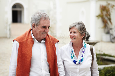 Buy stock photo Happy, talking and a senior couple in the city for a retirement holiday, travel and happiness. Smile, love and an elderly man and woman walking in an old town or hotel during a vacation together