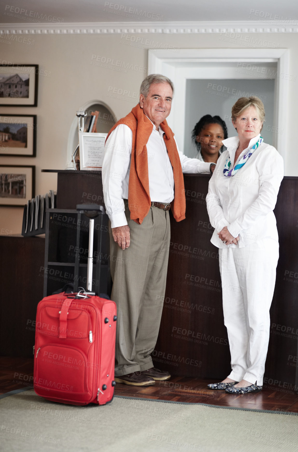 Buy stock photo Travel, hotel and senior couple by reception to check in desk for love, anniversary and relax. Retirement, hospitality resort and elderly man and woman with concierge for bonding, holiday or vacation