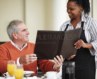 Buy stock photo Waitress, menu and senior man in a restaurant for breakfast or lunch at a hotel with service and choice of food. Friendly, order and elderly person happy on vacation or holiday for hospitality