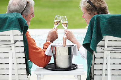 Buy stock photo Mature, man and woman with champagne for cheers in celebration of retirement on vacation at resort. Senior couple, love and romance for relationship, bonding and relaxing for quality time together