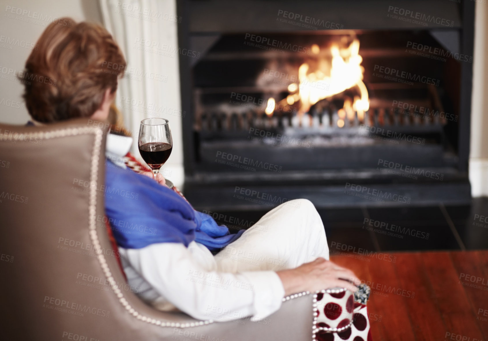 Buy stock photo Relax, fire and senior woman with wine, home and comfortable with health, wellness and peace. Back, mature female person or old lady in a lounge, alcohol and warm for winter, weekend break or resting