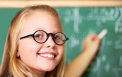 Buy stock photo Portrait, nerd and happy kid writing on chalkboard in class for learning, education and study math. Face, glasses and smile of geek at school, cute girl child and student in classroom in Australia