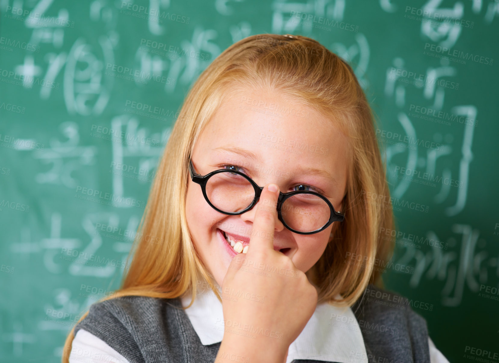 Buy stock photo Girl child, student with glasses and chalkboard for learning, education and to start math quiz in classroom. Happy face of smart, intelligent kid with vision, eye care and numbers on board for school