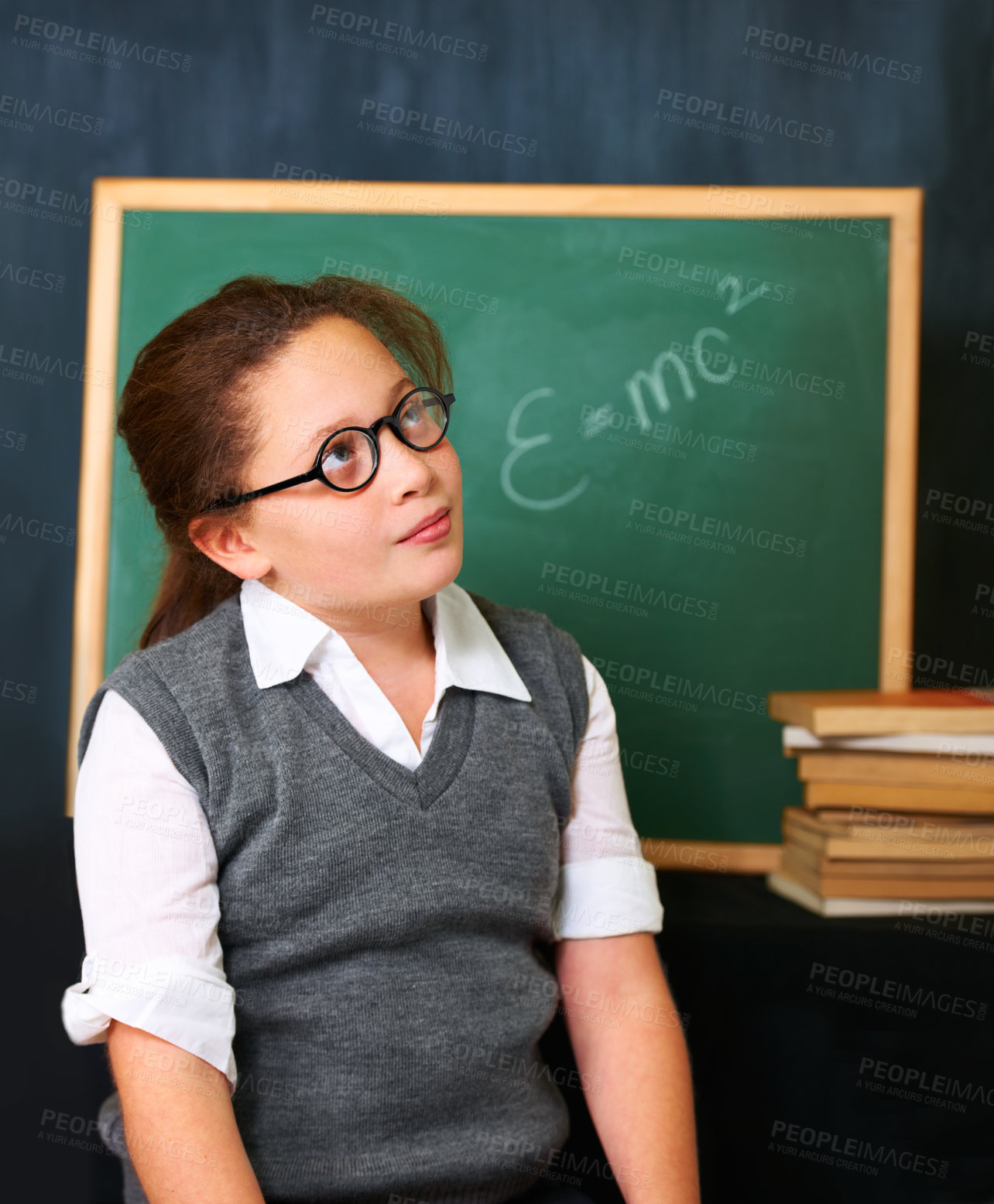Buy stock photo Thinking, solution and child student in classroom with idea, problem solving or brainstorming facel expression. Smile, education and young girl kid with glasses for learn or plan with board in school