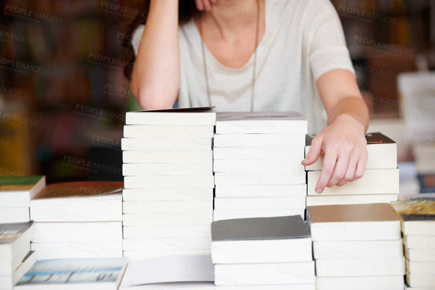 Buy stock photo Hands of person with books in library, bookstore or shop for research, learning and browse for purchase. Literature, knowledge and customer with book for education, information and reading for hobby