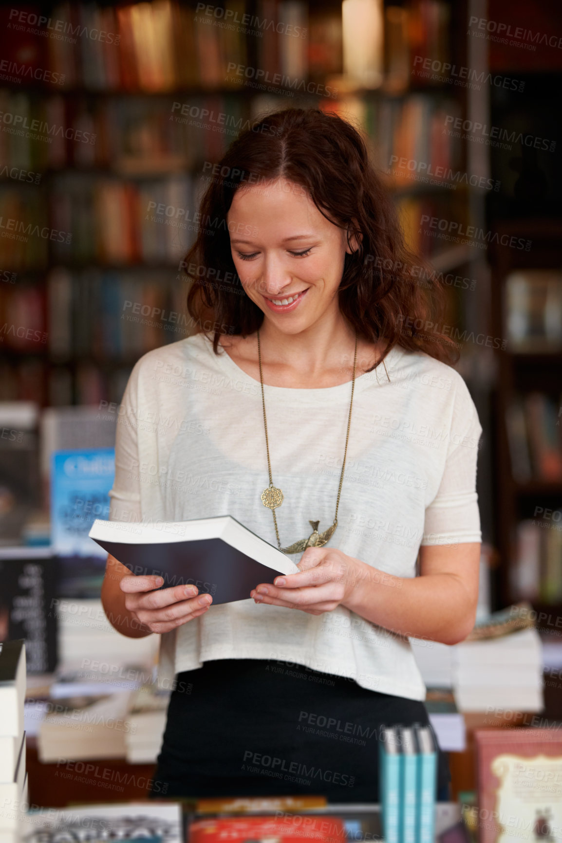 Buy stock photo Woman, bookshop and reading with sale, shopping and thinking for decision, smile and learning with ideas. Girl, novel or literature in store, library and college with deal, discount for knowledge