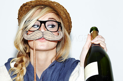 Buy stock photo Face, champagne and costume with a woman in studio isolated on a white background to party for celebration. Alcohol, mustache and character with a young person drinking or having fun at an event