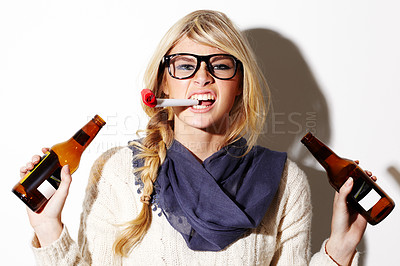 Buy stock photo Beer, portrait or woman with party blower for fun celebration, holiday vacation or hipster event in studio. New year, girl or female person drinking alcohol or beverage in bottle on white background 
