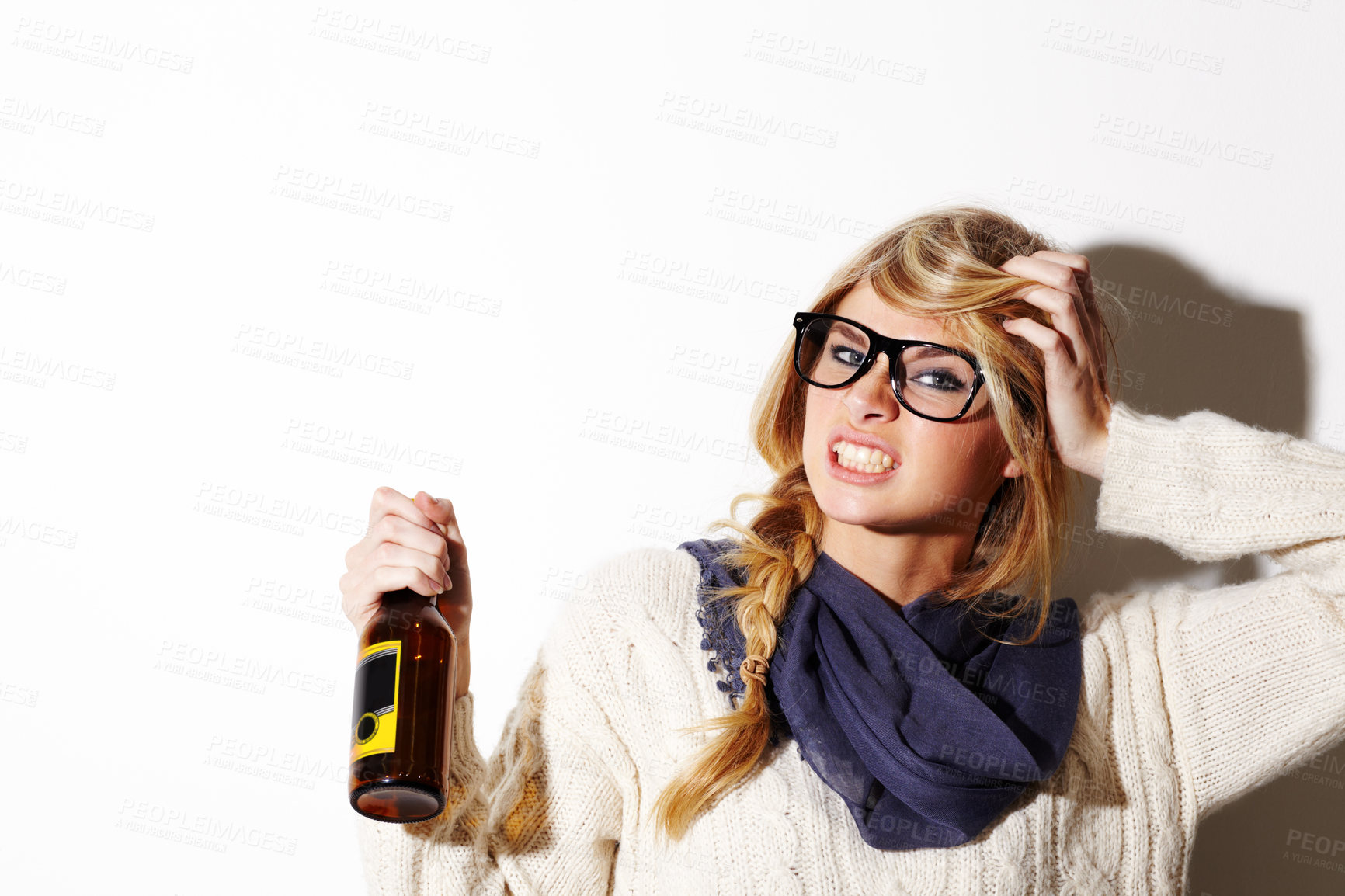 Buy stock photo Portrait, fashion and a bottle of beer with a woman in studio isolated on a white background of space for mockup. Face, alcohol and expression with a young drunk person drinking at a party or event
