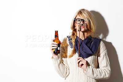 Buy stock photo Portrait, mustache and a bottle of beer with a woman in studio isolated on a white background of space for mockup. Face, alcohol and costume with a young drunk person drinking at a party or event