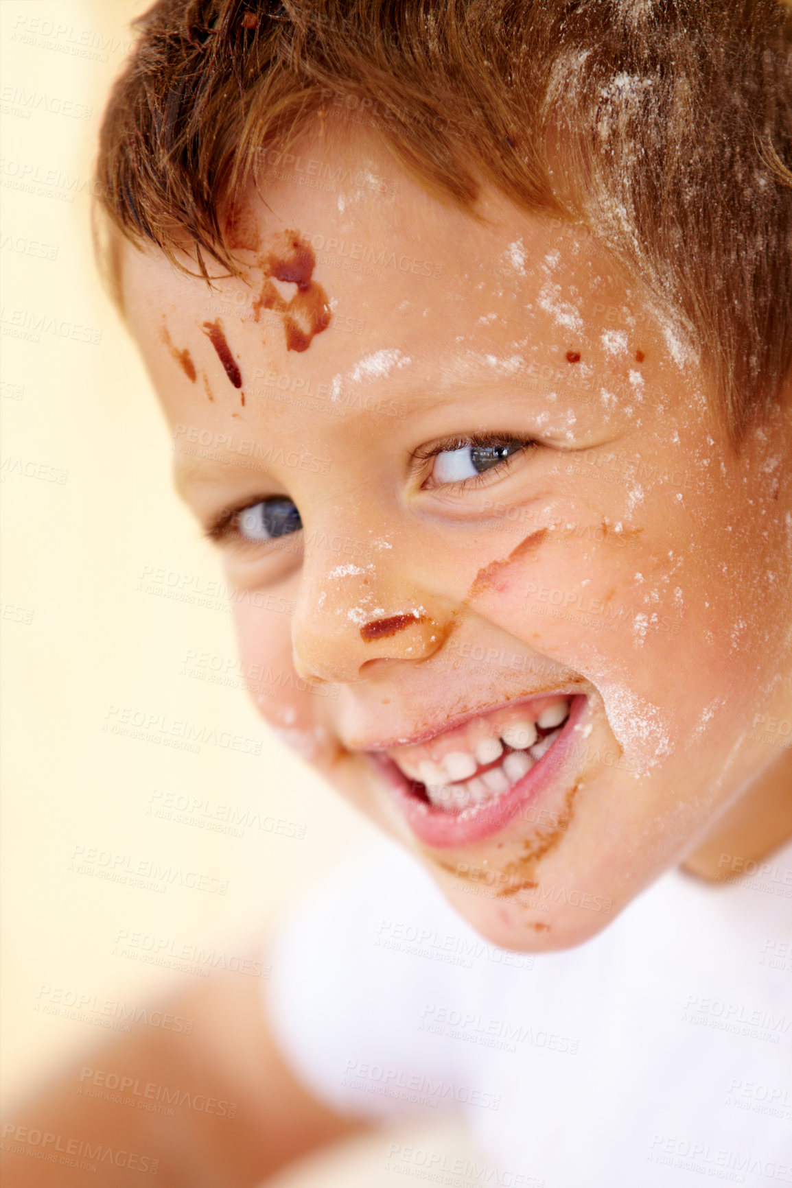 Buy stock photo Portrait, smile and flour with a child in the kitchen of his home, learning how to bake for development. Children, cooking and a happy young kid looking naughty with food ingredients on his face