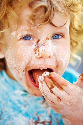 Buy stock photo Face, baking and a boy eating ingredients in the kitchen of his home while learning about food closeup. Happy, recipe and flour with a young child tasting sugar while cooking sweet, candy or dessert