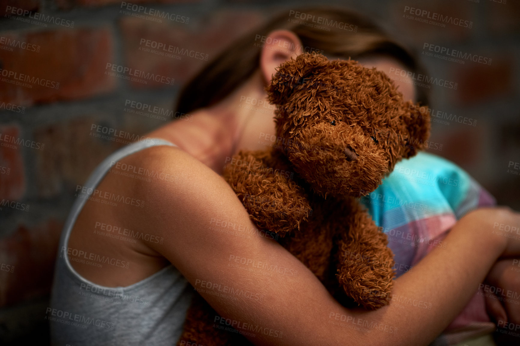 Buy stock photo Abuse, girl and child with fear, teddy bear and stress with depression, anxiety and bullying. Person, kid and victim with a toy, home and sad with mental health, crisis and trauma with development