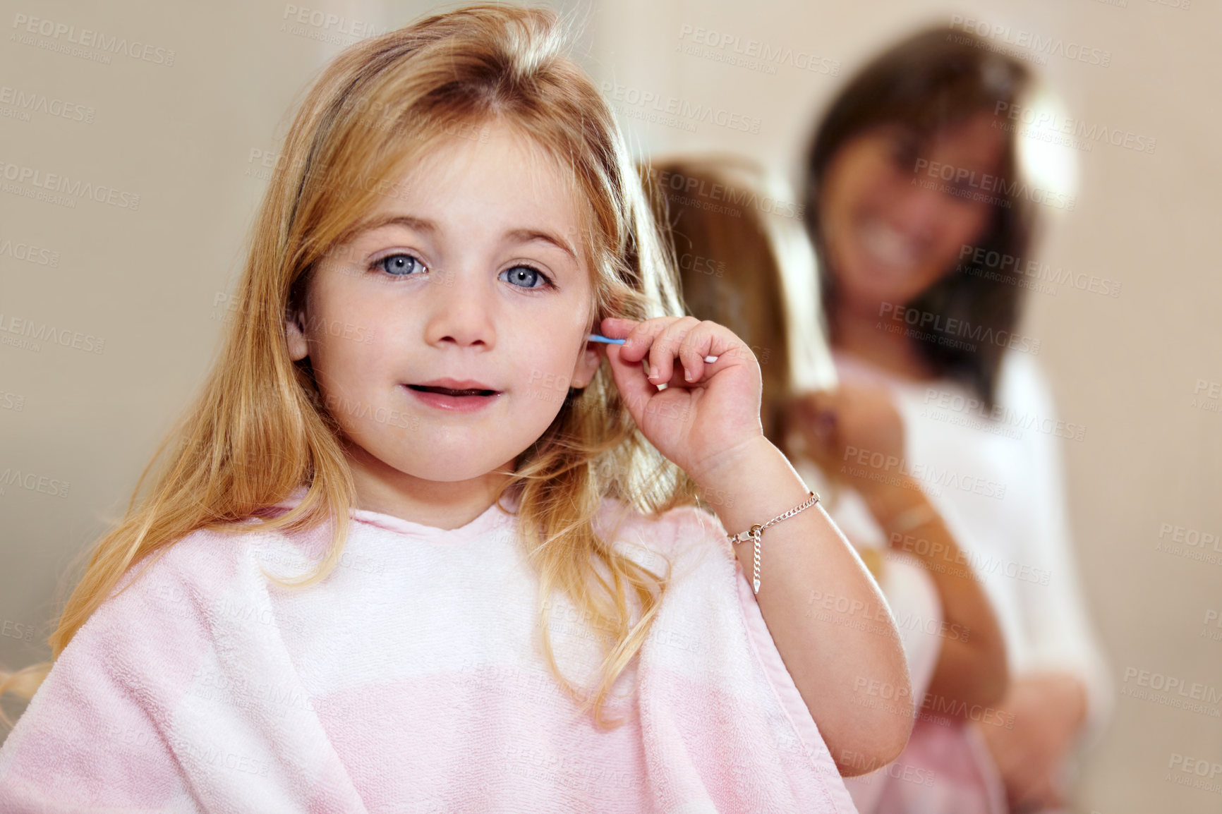 Buy stock photo Portrait, hygiene and a child cleaning ears with an earbud in a home bathroom for grooming. Smile, cotton and a girl or young kid learning to clean body during morning routine and getting ready