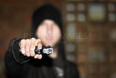 Buy stock photo View of a man holding a gun and pointing at you
