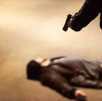 Buy stock photo Man lying on the ground after being shot by a gun-wielding criminal