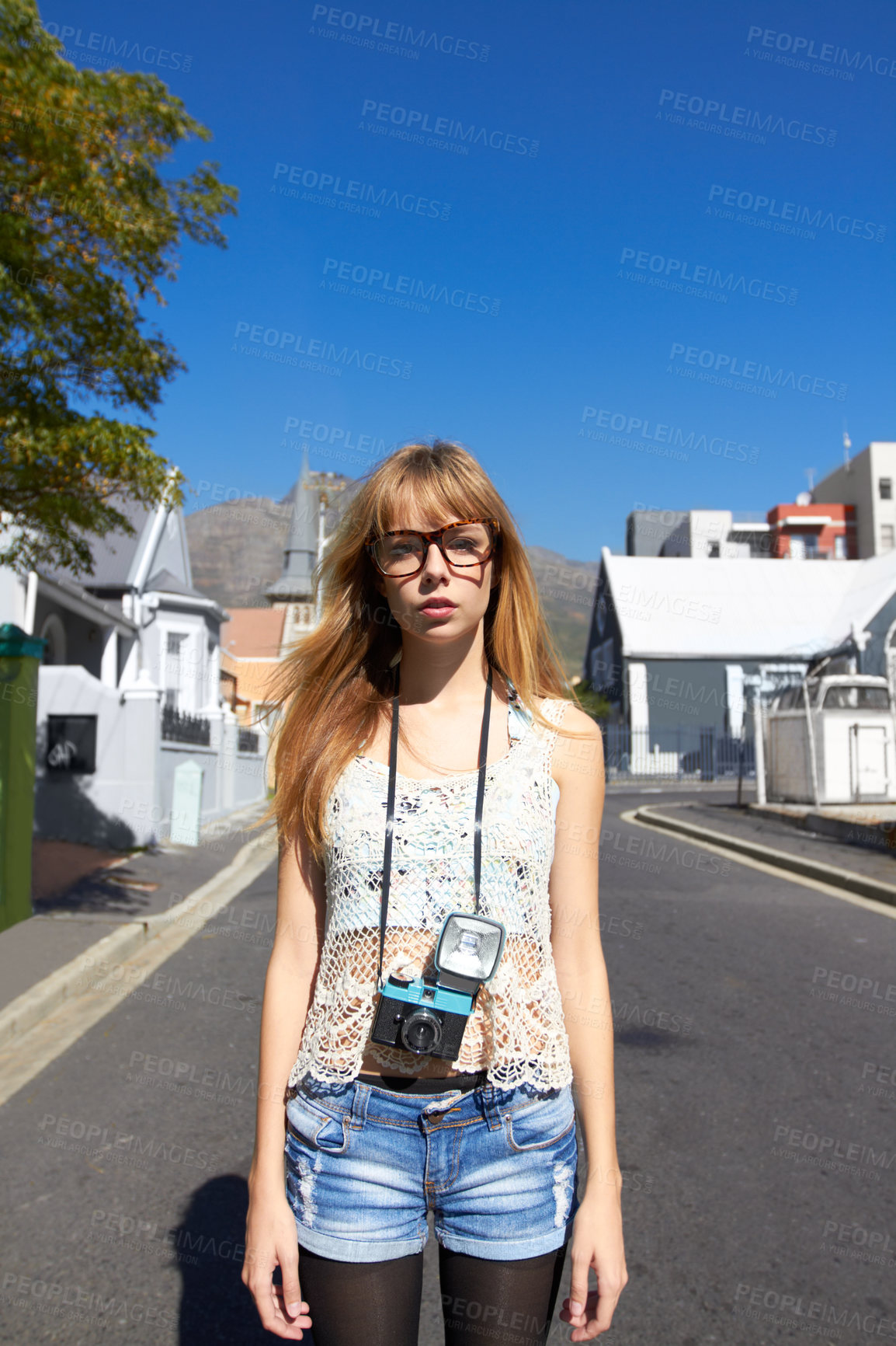 Buy stock photo City, photographer and portrait of serious woman with camera for creative and art career traveling. Gen z, paparazzi and young female person from Australia with dslr equipment for vacation in town.