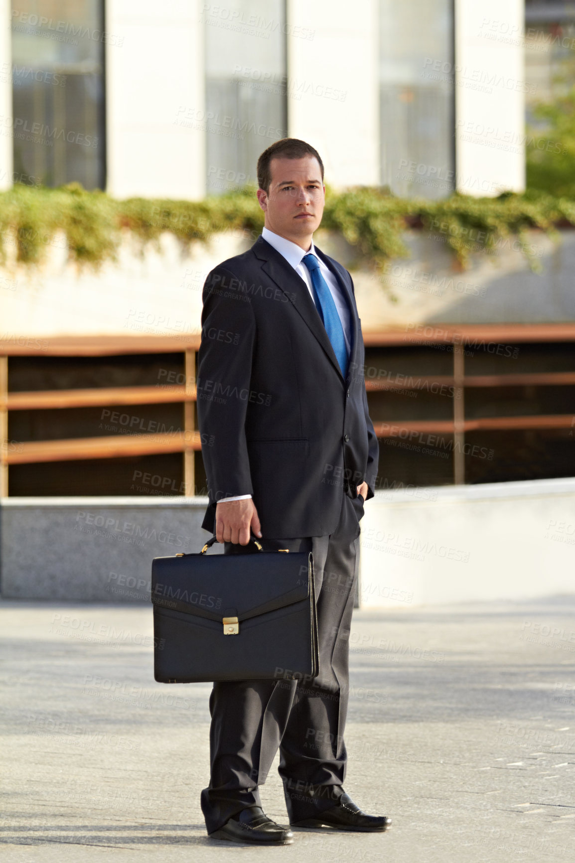 Buy stock photo Portrait of a businessman holding a briefcase