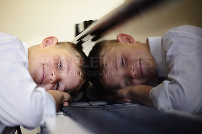 Buy stock photo Young, piano or student tired lesson or talent development, class practice or hobby fun. Boy, child or key music play instrument note or education rest for performance, sound learn or school show