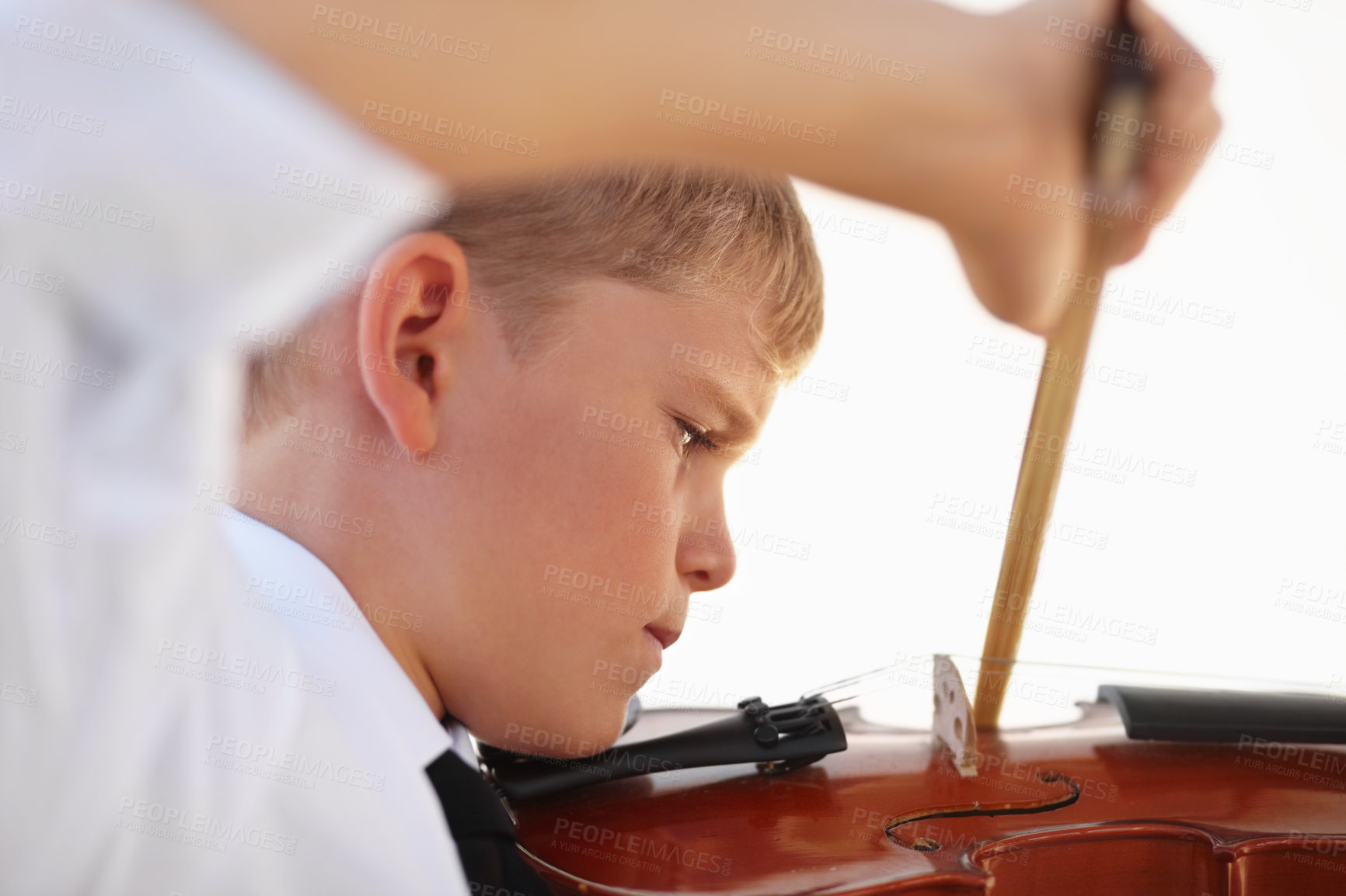 Buy stock photo Boy, violin or bow or music lesson, talent development or learning skill practice. Male person, school child or white background or instrument hobby education or concert, orchestra or listening audio