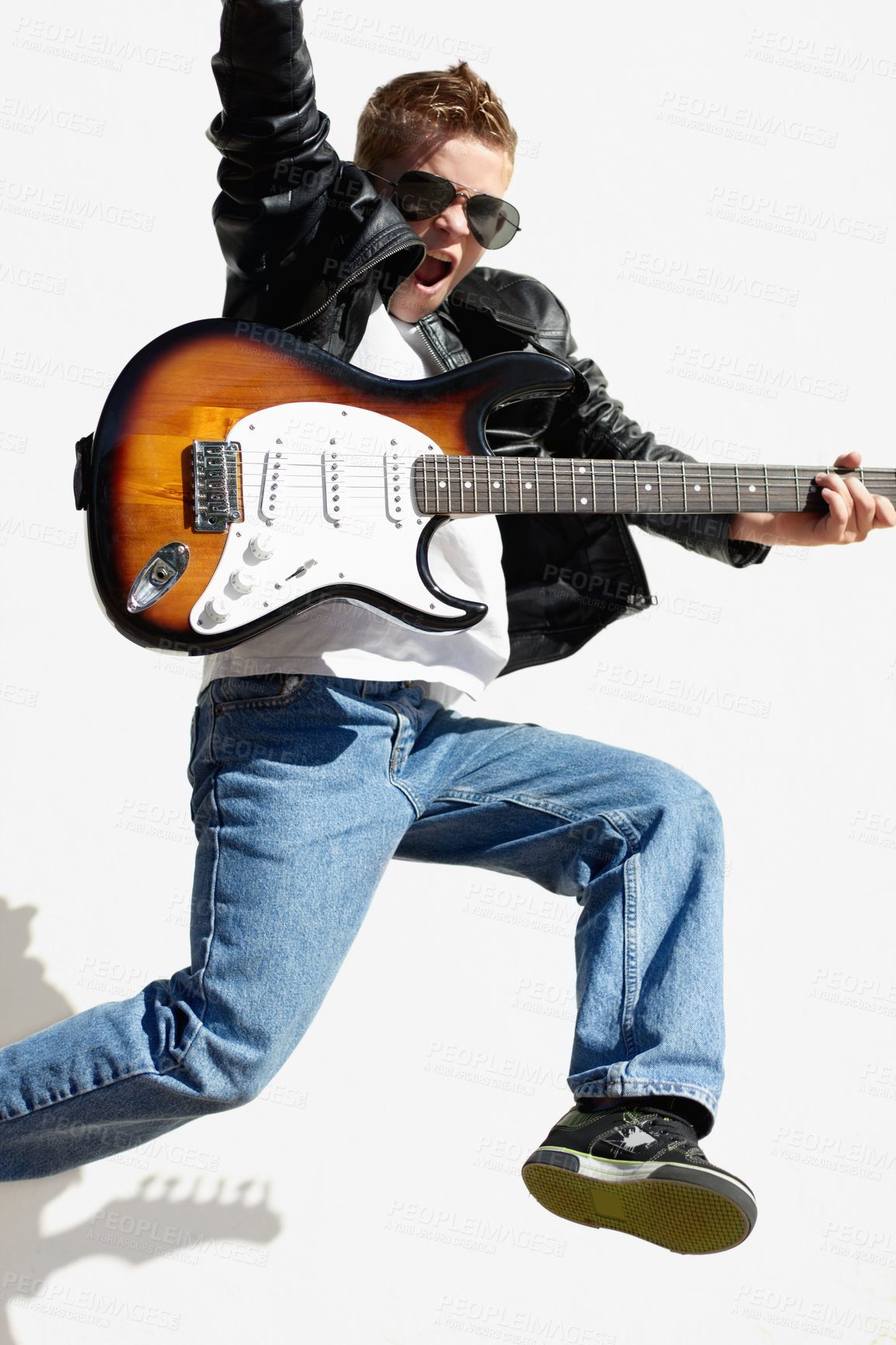 Buy stock photo Music, jump and child with guitar for creative sound, playing audio and cool young artist with sunglasses. Rock dance, excited boy in performance and talent show for children on white background.