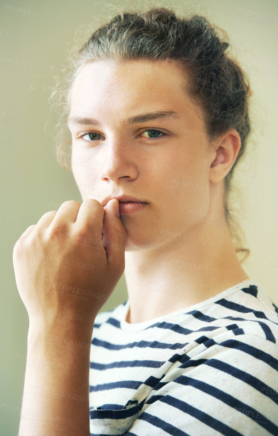 Buy stock photo Portrait, man and thinking in studio for fashion, clothes or style in London. Young person, male model and serious look on face, hand and mouth for hairstyle, cool or trendy on background in space