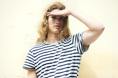 Buy stock photo Young man with long, curly hair and a casual sense of style looking at you