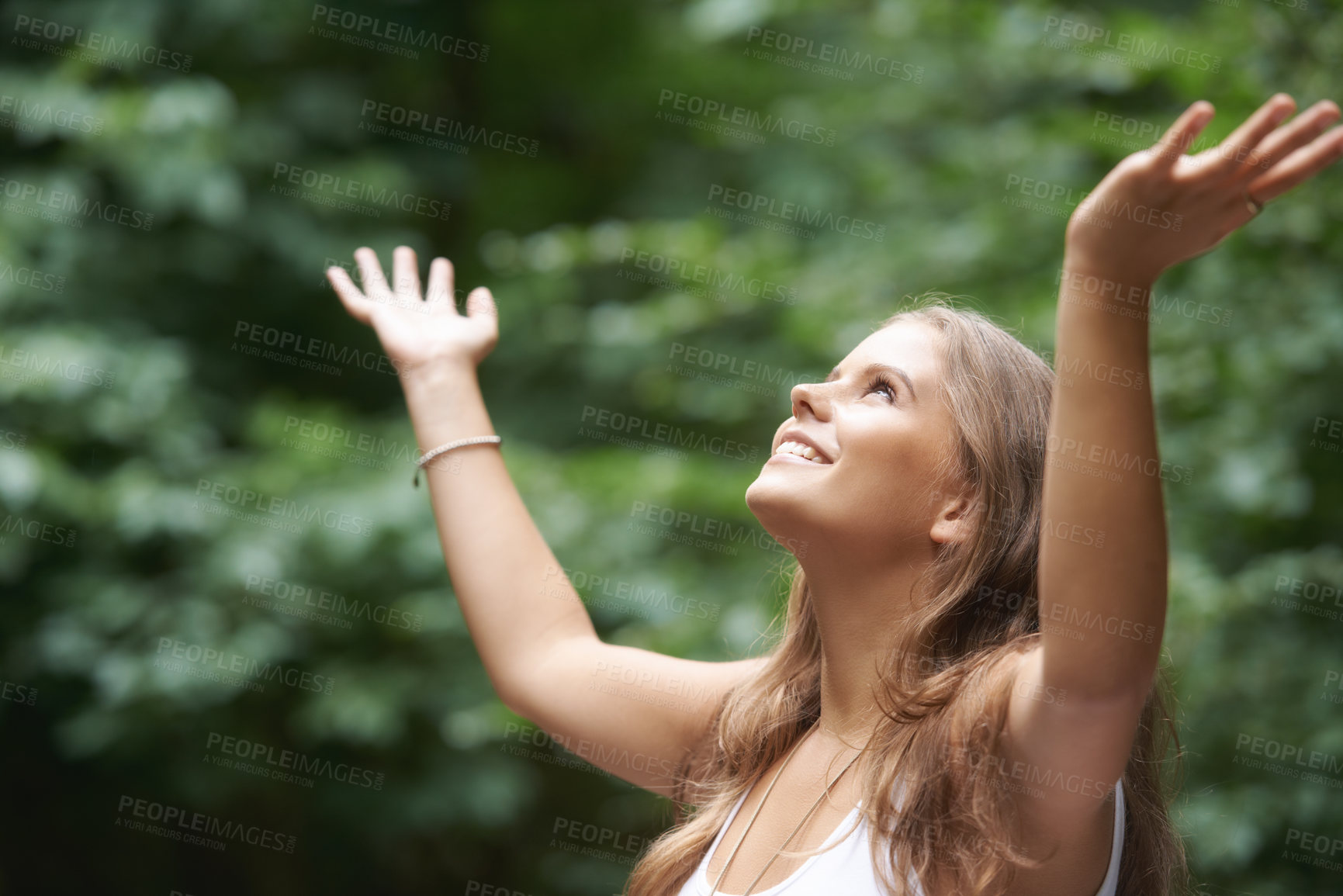 Buy stock photo Smile, freedom and a woman arms raised in the countryside for mental health, wellness or zen meditation. Summer, nature and a young person in the forest to relax for mindfulness or inner peace
