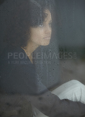 Buy stock photo Sad, rain and thinking with woman by window for depression, tired and lonely. Anxiety, mental health and exhausted with female contemplating at home for broken heart, disappointed and fear mockup