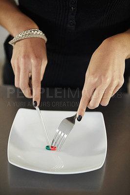 Buy stock photo Pills, plate and hands of woman with cutlery for anorexia, eating disorder and weight loss issue. Drugs, health and female person with knife and fork cutting diet pill or medication for food problem