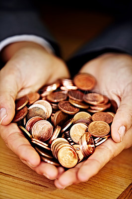 Buy stock photo Closeup shot of a man holding coins in his cupped hands
