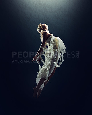 Buy stock photo A beautiful young woman floating in the air isolated against black