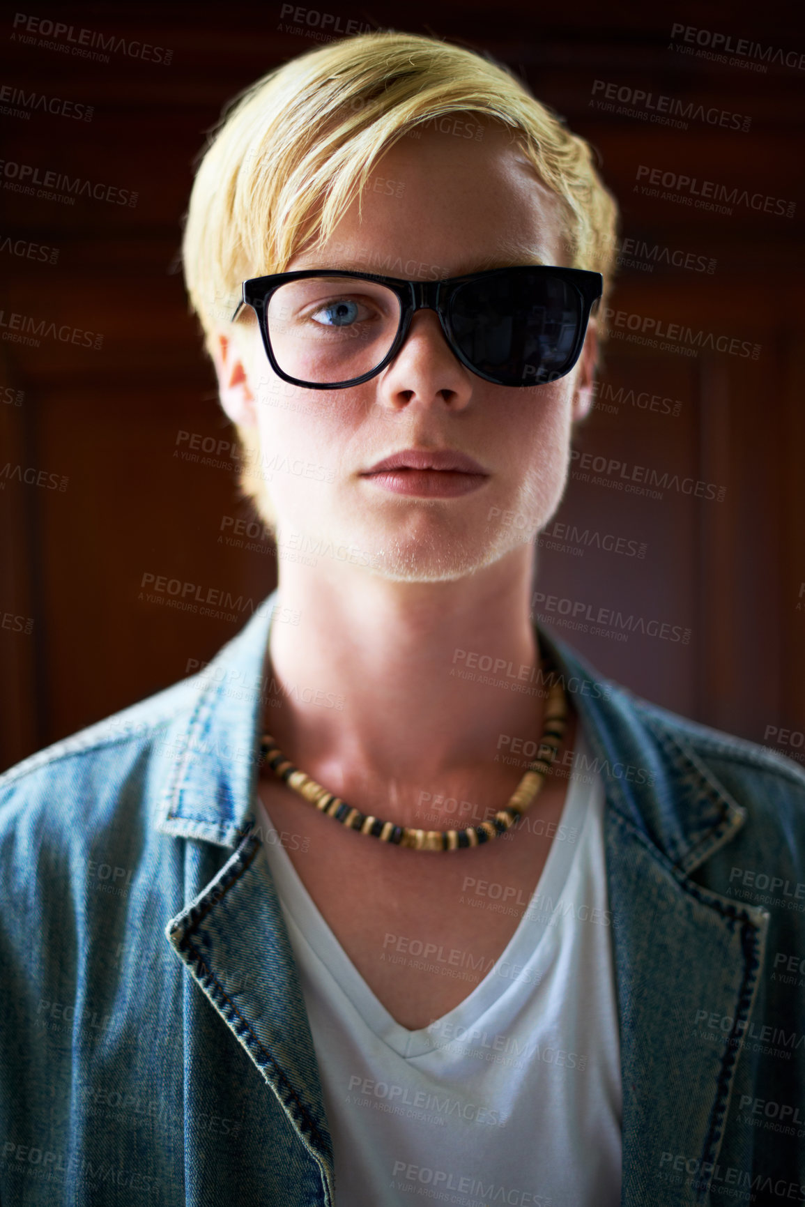 Buy stock photo Attractive young guy wearing hipster glasses with one side blacked out