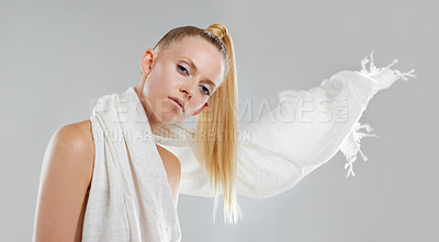 Buy stock photo Beauty, cosmetics and fabric, portrait of woman in studio with skin glow, creative facial and luxury skincare. Fashion, makeup and face of model with unique aesthetic on white background with silk.