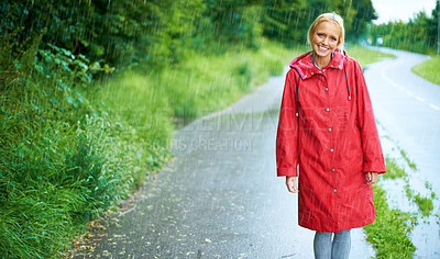 Buy stock photo Woman, smile and raincoat in outdoor rain, wet and cold from weather, winter and nature. Happy female person, road and red jacket is trendy, rainfall and protection from water, face and holiday