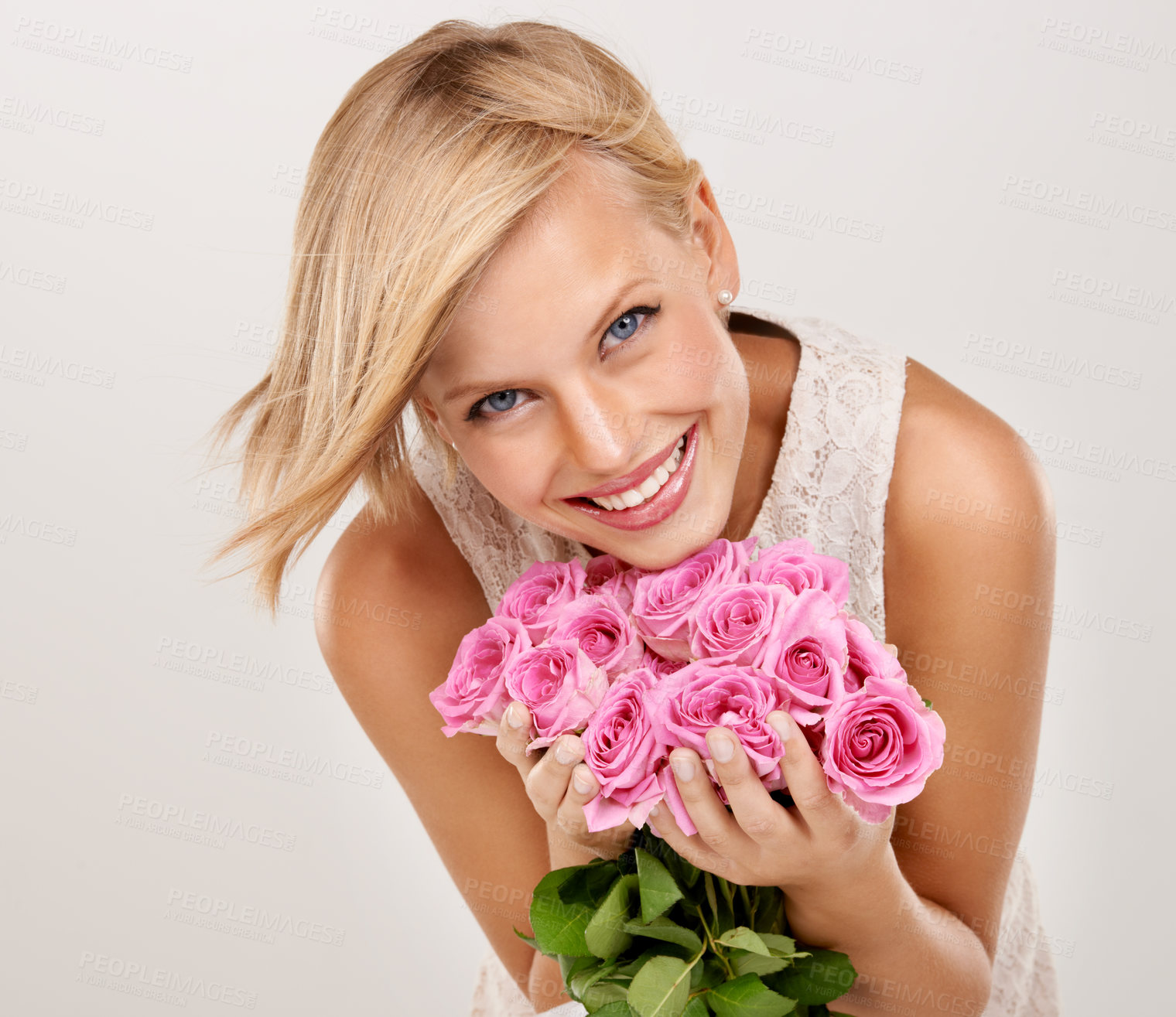 Buy stock photo Portrait of an attractive young woman holding a bouquet of flowers