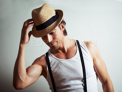 Buy stock photo Straw hat, fashion and young man in a studio posing with trendy, stylish and cool outfit. Smile, attractive and handsome male model with casual style and accessory isolated by white background.