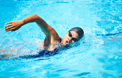 Buy stock photo Female swimmer doing freestroke in a pool