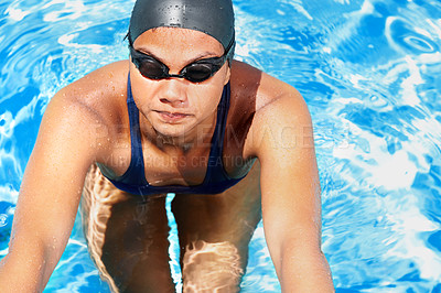 Buy stock photo Woman, athlete and swimming in pool of blue water for challenge, sports and training from above. Professional swimmer with goggles for performance, exercise and triathlon competition, contest or race