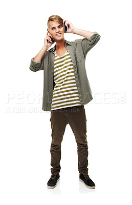 Buy stock photo Happy, man and listening to music with headphones in studio white background streaming audio online. Radio, portrait and relax with rock sound, metal or hip hop track on technology with a smile