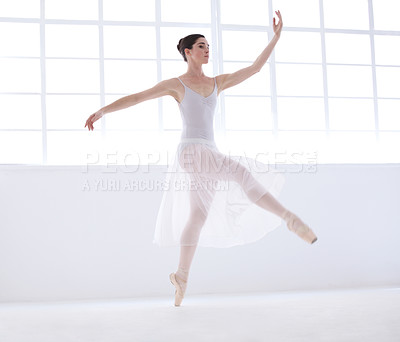 Buy stock photo Performance, ballet and creative with woman in studio for balance, elegant and dance. Artist, theatre and training with female ballerina dancing in class for competition, freedom and commitment
