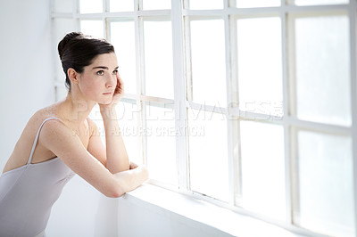 Buy stock photo Woman, ballet dancer and thinking at window for future creative, artistic vision or passion goals. Female person, elegant costume and idea thoughts for hair bun dreaming, career or performance plan
