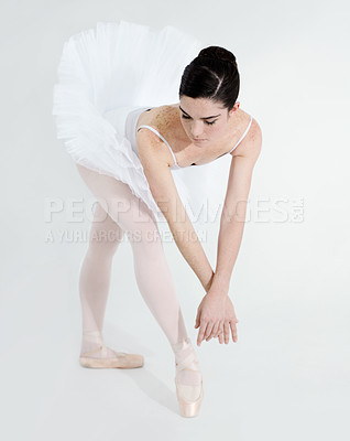 Buy stock photo Art, dance and ballet with a woman in studio on a white background for rehearsal or recital for theatre performance. Training, creative and flexible with a young female ballerina or dancer in uniform