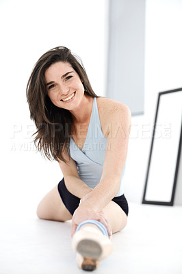 Buy stock photo Stretching legs, ballet and portrait of woman training in studio sitting on floor. Ballerina stretch, face and happy athlete from Canada warm up for exercise, dance and fitness, workout and practice.