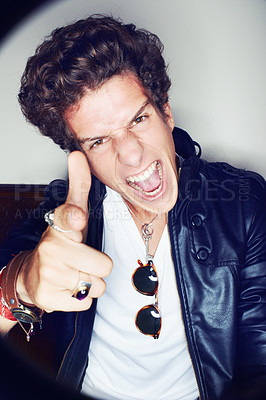 Buy stock photo Man, gun finger and studio portrait with shouting, crazy or sign for attitude in spotlight by white background. Rock person, artist or musician in vintage leather jacket, edgy clothes or point at you